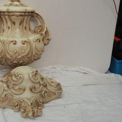 Lot 13 Plaster Faux wall fountain hangs on wall