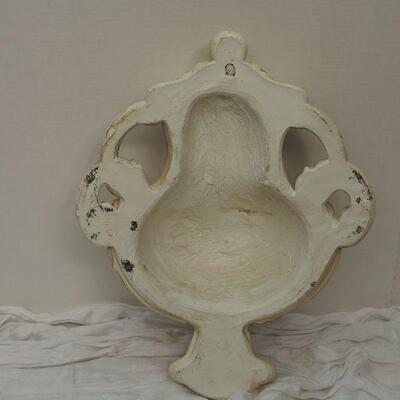 Lot 13 Plaster Faux wall fountain hangs on wall