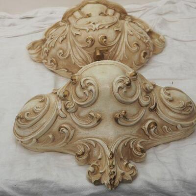 Lot 13 Plaster Faux wall fountain hangs on wall