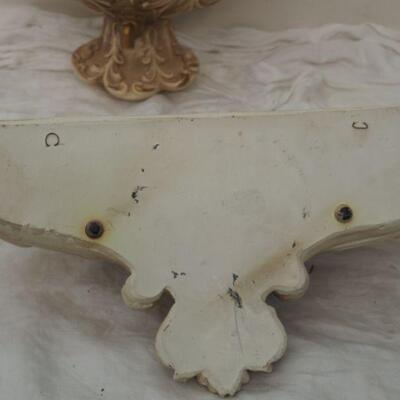 Lot 13 Plaster Faux wall fountain hangs on wall