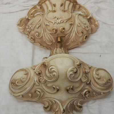 Lot 13 Plaster Faux wall fountain hangs on wall