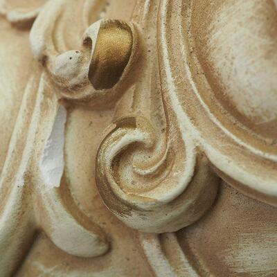 Lot 13 Plaster Faux wall fountain hangs on wall