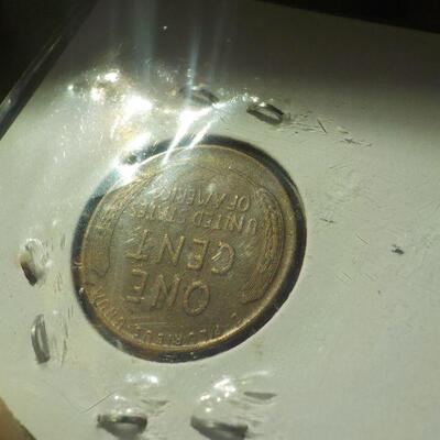 1933 D Lincoln copper penny.