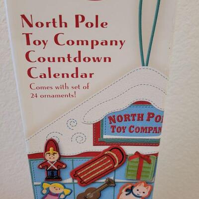 Lot 190: New Christmas Countdown Calendar and Baby Ornaments 