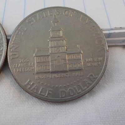 2- Kennedy Centenneial Half dollars.