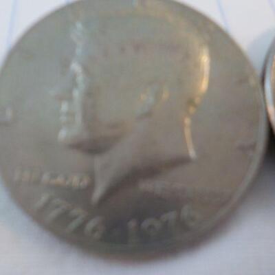 2- Kennedy Centenneial Half dollars.