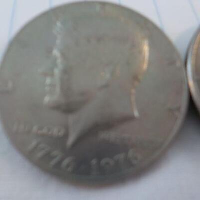 2- Kennedy Centenneial Half dollars.