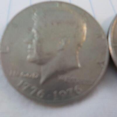 2- Kennedy Centenneial Half dollars.