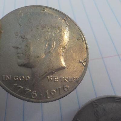 2- Kennedy Centenneial Half dollars.