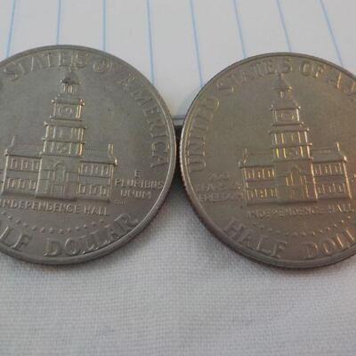 2- Kennedy Centenneial Half dollars.