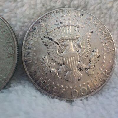 2 - 1962 and 1964 Kennedy silver half dollars.
