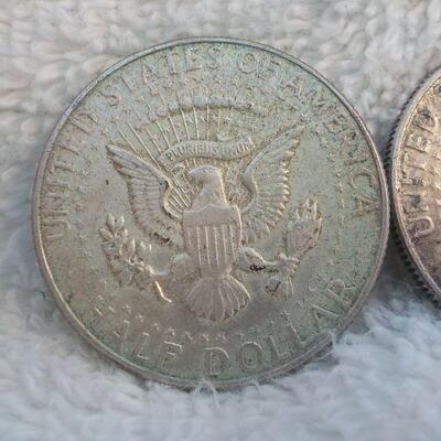 2 - 1962 and 1964 Kennedy silver half dollars.