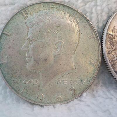 2 - 1962 and 1964 Kennedy silver half dollars.