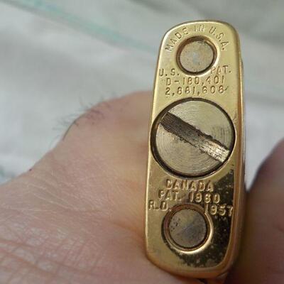 Scripto vu-lighter with gold trim.