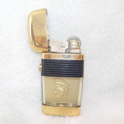 Scripto vu-lighter with gold trim.