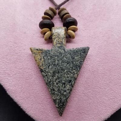 Lot #27 - Carved stone arrowhead with small fossils