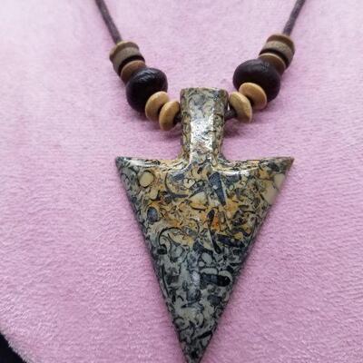 Lot #27 - Carved stone arrowhead with small fossils