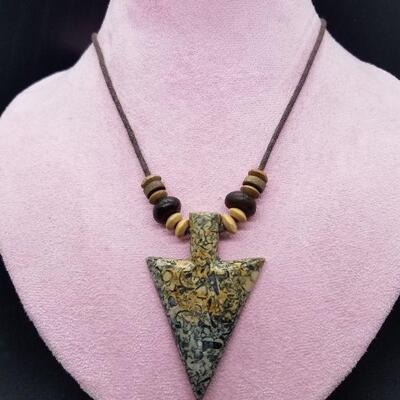 Lot #27 - Carved stone arrowhead with small fossils