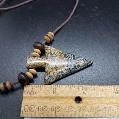 Lot #27 - Carved stone arrowhead with small fossils