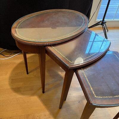 #45 Nesting Set of Tables, Leather Tops with Glass over. 