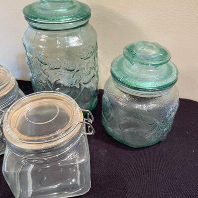 #83 5 Glass Kitchen Jars with lids.