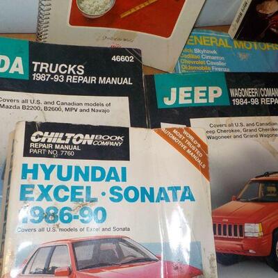 Vintage auto repairs books and 2 cook books of Chinese food.