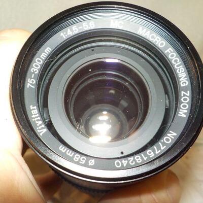 " Telephoto Lens / Macro Focusing zoom."