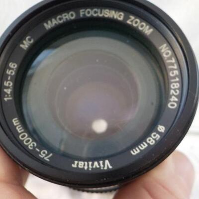 " Telephoto Lens / Macro Focusing zoom."