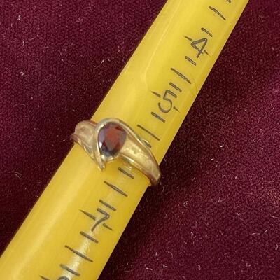 #13 Gold Ruby Ring tests as 14k 3.6 g. can't make out mark