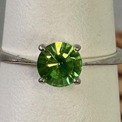 #119 Silver with bright light Green Stone Cut. Ring with  .925  Size 7 1.9 g 