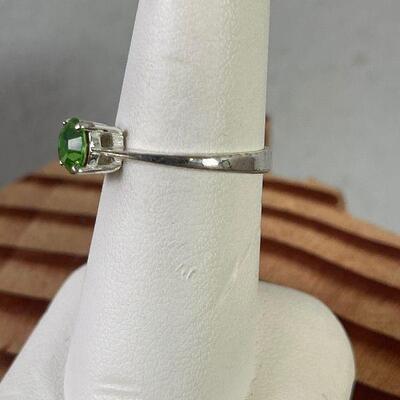 #119 Silver with bright light Green Stone Cut. Ring with  .925  Size 7 1.9 g 