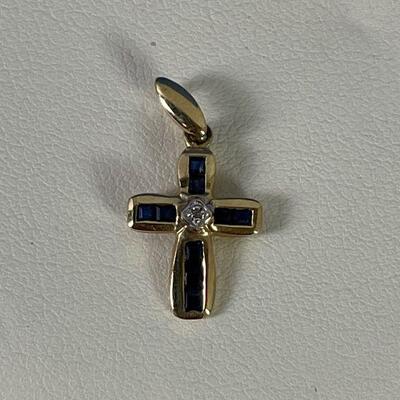 #177 10K Gold Cross with tiny Diamond and Blue Sapphire .8 grams 