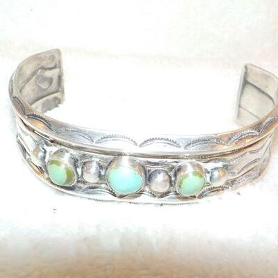 " Navaho hand made Coin silver w/ torques Braclet."