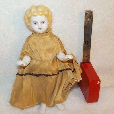 " Porcelain Doll late 1800's with original clothes".