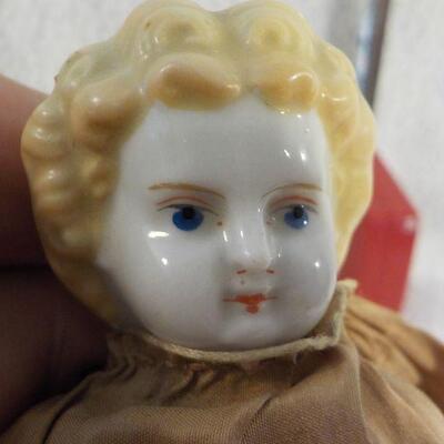 " Porcelain Doll late 1800's with original clothes".