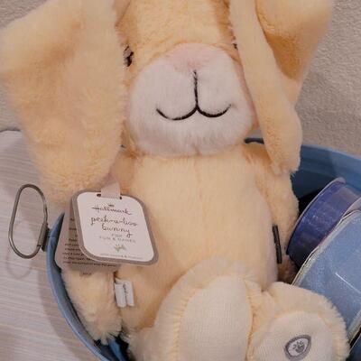 Lot 40: New Baby Book, Ribbon, Patricia Reach Musical Ornament, Peek-a-Boo Bunny and vintage Peter Rabbit Tin
