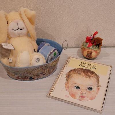 Lot 40: New Baby Book, Ribbon, Patricia Reach Musical Ornament, Peek-a-Boo Bunny and vintage Peter Rabbit Tin