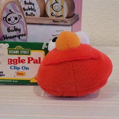 Lot 186: Melissa & Doug NEW Magnetic Bath Bottle Collection + New Elmo Clip On Giggle Toy