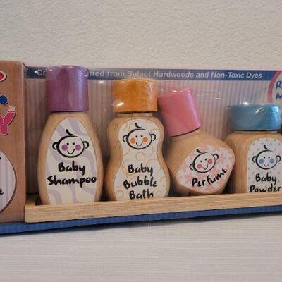 Lot 186: Melissa & Doug NEW Magnetic Bath Bottle Collection + New Elmo Clip On Giggle Toy