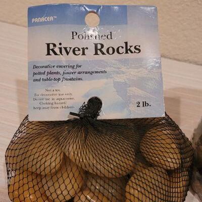 Lot 249: (2) New Bags of River Rocks and New Seashell Candle  