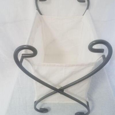 Lot #68 - Folding Wrought Iron and cotton magazine holder