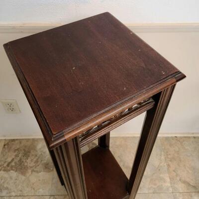 Square wooden pedestal table