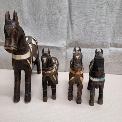 Set of 4 vintage, hand carved folk art horses