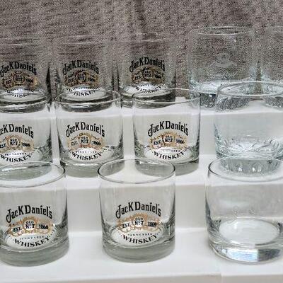16 bar glasses: 11 Black/Gold Jack Daniels, 2 clear etched Jack Daniels, 3 clear Crown Royal