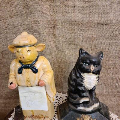 Cast iron cat and pig door stops 