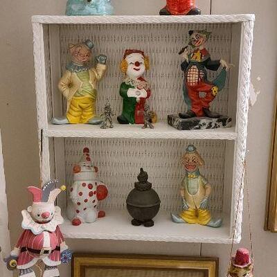 13 pc. Vintage clown collection with white wicker shelf.