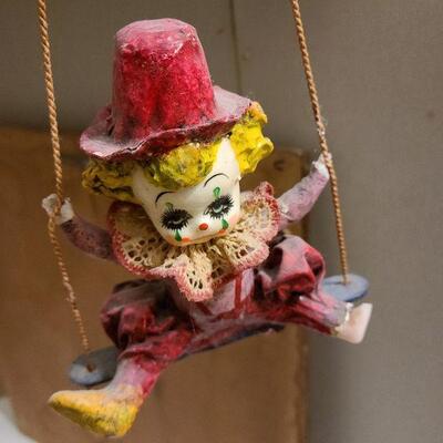 13 pc. Vintage clown collection with white wicker shelf.