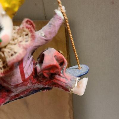 13 pc. Vintage clown collection with white wicker shelf.