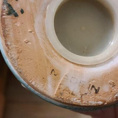 13 pc. Vintage clown collection with white wicker shelf.