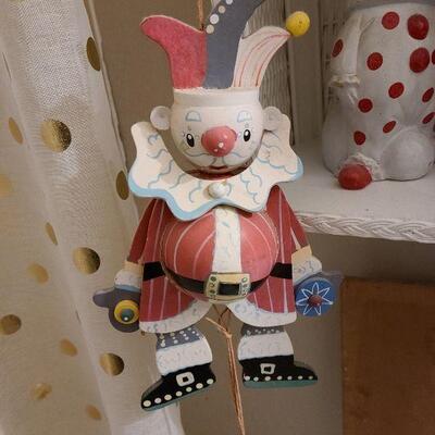 13 pc. Vintage clown collection with white wicker shelf.